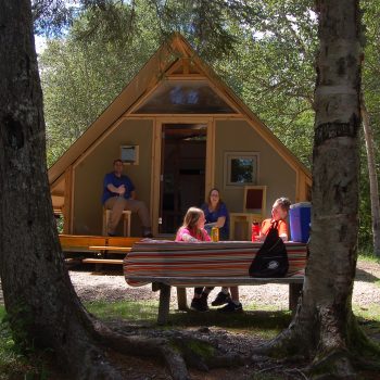 people chatting at a cabin in Fundy National Park