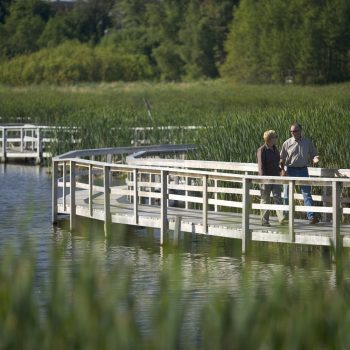 Couple walking on boardwalk