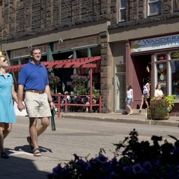Couple walking down a town street