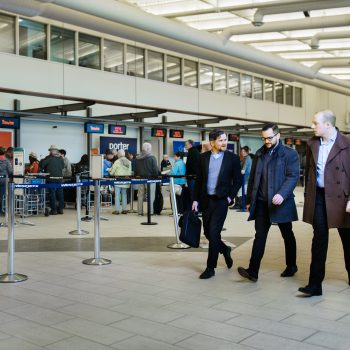 People walking by the check in counters