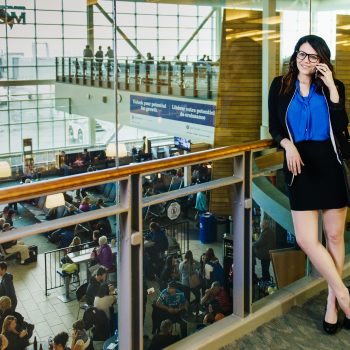 A woman talking on her phone at the airport