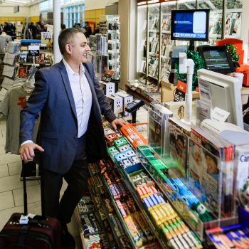 A man making a purchase at a kiosk